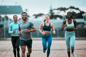 Sculpting Sleek Arms: The Essential Role of Cardio in Toning Without Bulking Up 3 image of people running to incorporate cardio Stanford-le-Hope exercise into their life to help tone arms and body.